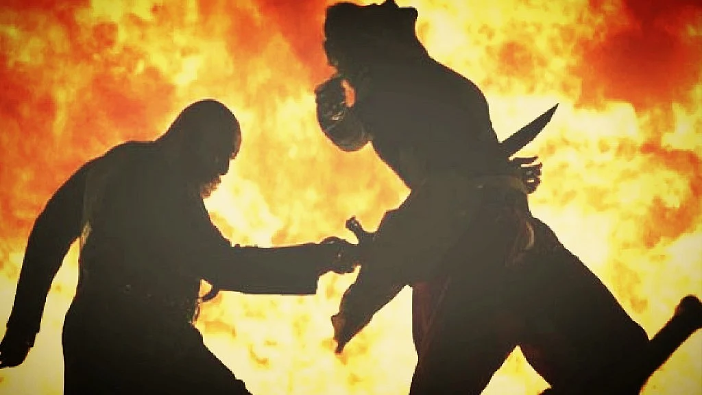 Image from the Baahubali film featuring Prabhas as Baahubali and Satyaraj as Kattappa